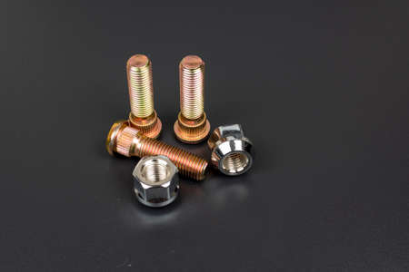 car wheel nuts with studs on white background