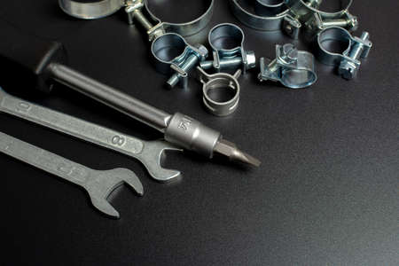 professional tool on a black background with a set of repair clamps
