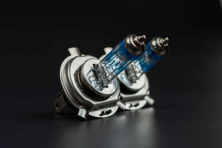 close-up of blue electric bulbs head light car on black backgroundの写真素材