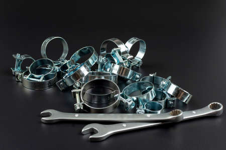 close-up on a black background metal clamps and repair toolsの写真素材
