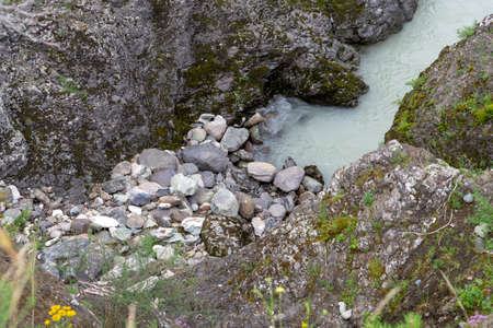 small bay in stone on the bank of a mountain river