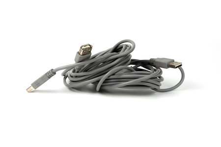 connecting cord for USB connectors of a personal computer coiled into a tight coil. copy space
