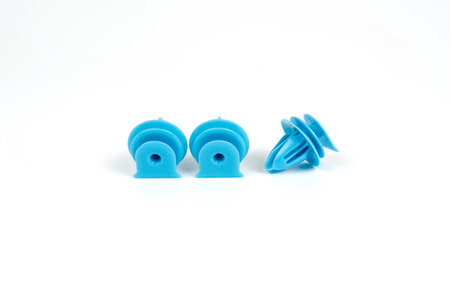Plastic blue clips for cars. Close up. Isolated on white background