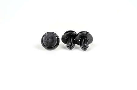 Plastic Black Clips For The Car. Close Up. Isolated On A White Background