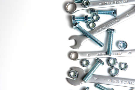 several open-end metal wrenches for working with bolts. Close-up on a white background. Silver metal...