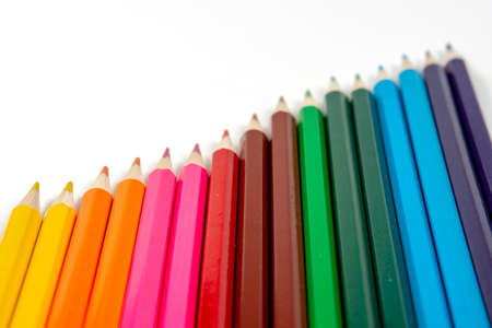 Colored pencils isolated on white background. close up, copy space