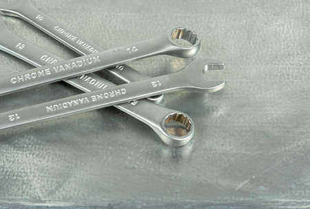 metal keys isolated on metallic gray background. copy spaceの写真素材