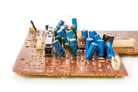 Electronic board with radio components, connectors, slots and processor chip from electronic device isolated on white background. Top view. close-upの写真素材