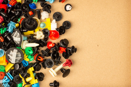 Close-up of plastic colored clips for car. Panel plastic rivets, Auto plastic clips.