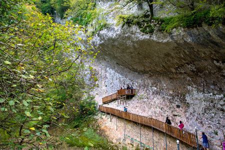 Gagra, Abkhazia - October 11, 2024 : A bridge along the edge of a gorge washed by a mountain river.の写真素材