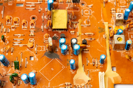 Electronic board with radio components, connectors, slots and processor chip from electronic device isolated on white background. Top view. close-upの写真素材