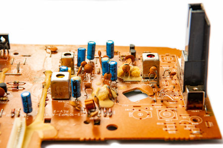 Electronic board with radio components, connectors, slots and processor chip from electronic device isolated on white background. Top view. close-upの写真素材