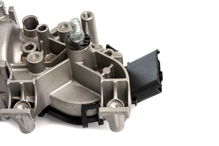 An electric motor with a gearbox and a spline rod for the car wiper blade mechanism. A detail for a car on a white background. Auto parts for car repair,の写真素材