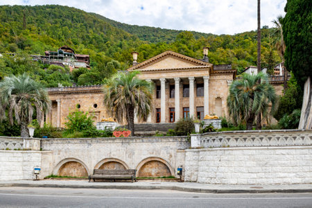 Gagra, Abkhazia-October 11 2024 : Old historical building with columns among the mountains in the Republic of Abkhazia. Building of the Winter Theater in Gagra. Sunny autumn dayの写真素材