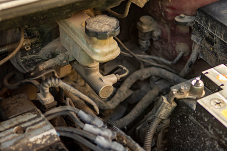 Top view of the dirty engine of an old car in need of repair. Car engine maintenance. Selective focus. Close-up, Car engine conditionsの写真素材