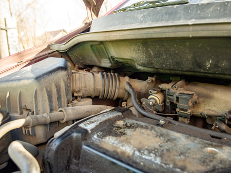 Top view of the dirty engine of an old car in need of repair. Car engine maintenance. Selective focus. Close-up, Car engine conditionsの写真素材