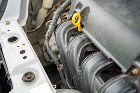 Detailed view of a modern car engine with exposed elements under the hood. Close-ups of various...