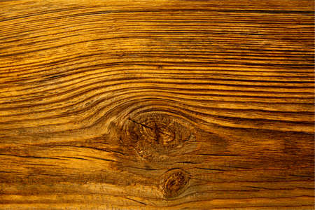 A board made of old dark wood, damaged by sun and rain.の写真素材