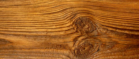 A board made of old dark wood, damaged by sun and rain.の写真素材