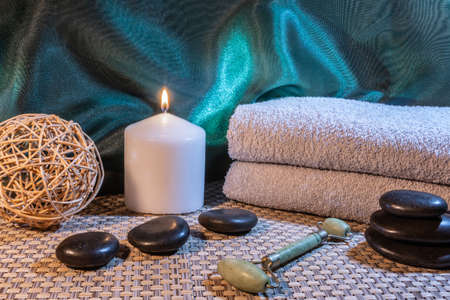 Spa, zen basalt stones, towels, candles in the massage room.の写真素材
