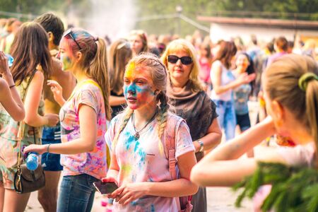 Kemerovo, Russia, June 24, 2018: A young girl painted in colored powder at a holi festival of colorsのeditorial素材