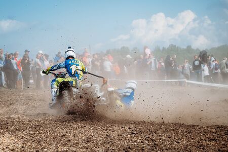 Lebedyanka, Russia - August 25, 2019: Russian Motocross Championship, motocross racer accelerating in dirt trackのeditorial素材