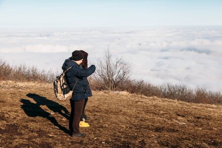 Pyatigorsk, Stavropol Territory / Russia -  January 21, 2019 : people at the top of the mountain enjoy the view, look at the beautiful scenery above the cloudsのeditorial素材