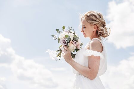 bride with bouquet of flowersの写真素材