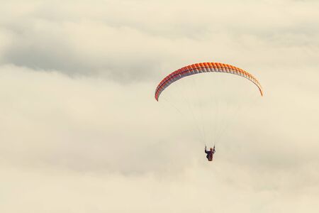 paraglider in the sky tonedの写真素材