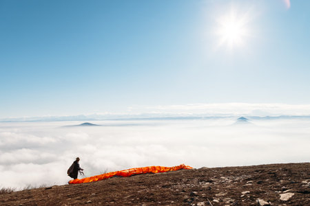 paraglider preparing to jumpの写真素材