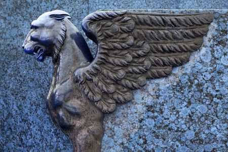 sculpture of griffin on embankment in Petersburg (sculptural ensemble of two sphinxes and four griffins) - blue colorsの写真素材
