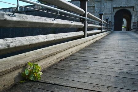 fence and wooden lane to castleの写真素材