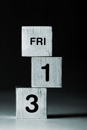 text FRI-13 on metal cubes (black background)