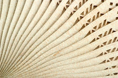 decorative wooden Japanese fan with ornamentの写真素材