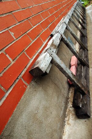 old stairs near the brick wallの写真素材