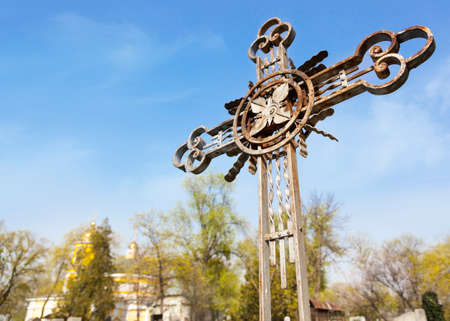 Metal graveyard cross in cemeteryの写真素材