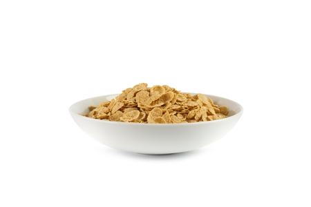 Corn flakes isolated in a plate on white background.の写真素材