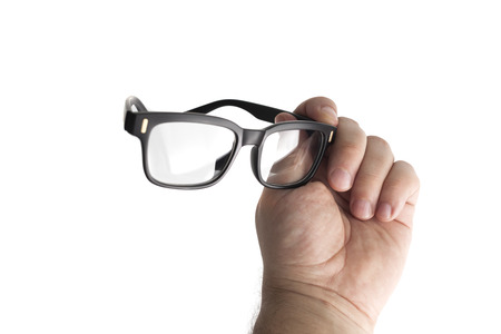 Black Eye Glasses in man's hand Isolated on White backgroundの写真素材