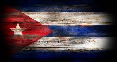 Grunge Cuba flag on a wood surfaceの写真素材