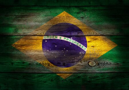 Flag of Brazil painted on grungy wooden plank backgroundの写真素材
