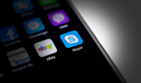 Chisinau, Moldova - September 1, 2017: Skype logo on smartphone screen on black background.のeditorial素材