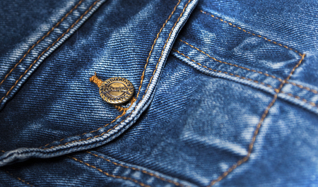 CHISINAU, MOLDOVA - December 25, 2017: Jeans jacket Wrangler blue color. Pocket closeup. The Wrangler brand is owned by VF Corporation of Greensboro, North Carolina USA. Blurred conceptのeditorial素材