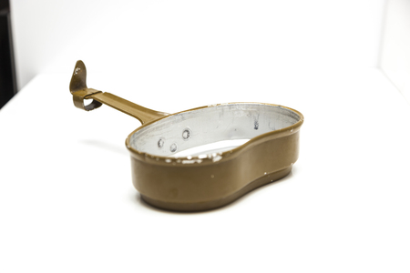 Soviet Army opened cooking pot isolated on white backgroundの写真素材