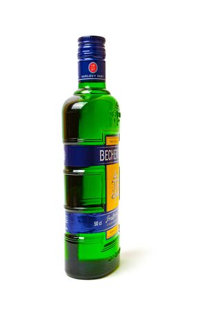 CHISINAU, MOLDOVA - APRIL 21, 2019: Product shot of Czech herbal bitters Becherovka bottle isolated on white backgroundのeditorial素材