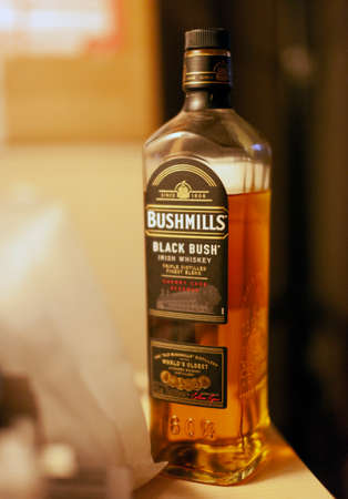 CHISINAU, MOLDOCA - FEBRUARY 19, 2021: Bottle of Bushmills Original Irish whiskey, product of Old Bushmills Distillery founded in 1608, today owned by Casa Cuervo. Concept photoのeditorial素材