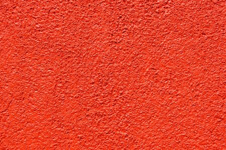 close up red cement plaster wall background and texture