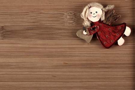Christmas angel decoration on wood backgroundの写真素材