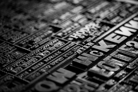 Macro shoot of an old vintage Victorian newspaper book printing press backgroundの写真素材