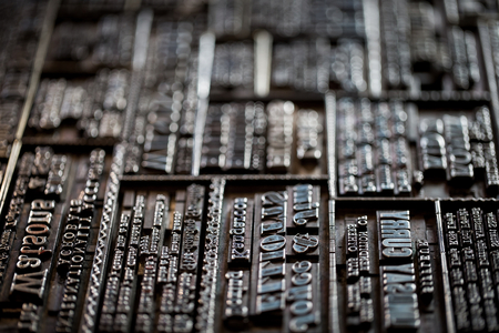 Macro shoot of an old vintage Victorian newspaper book printing press backgroundの写真素材