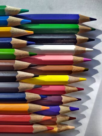 Wood pencils in all colors , placed on a flat base. Education and back to schoolの写真素材